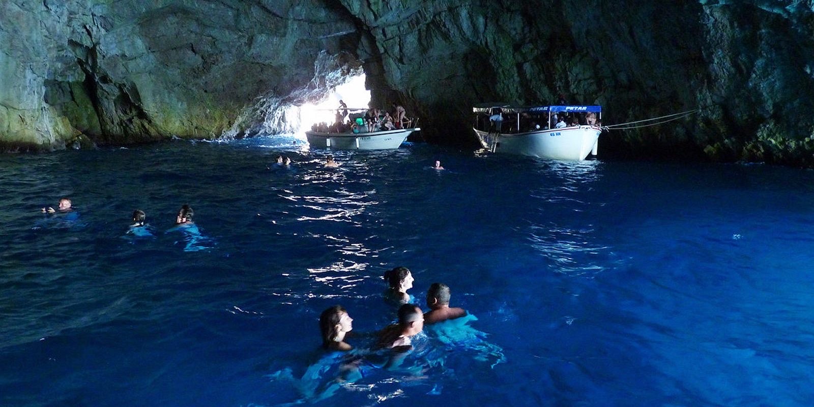 Blue Cave interior with luminous blue light, Koločep island, Dubrovnik