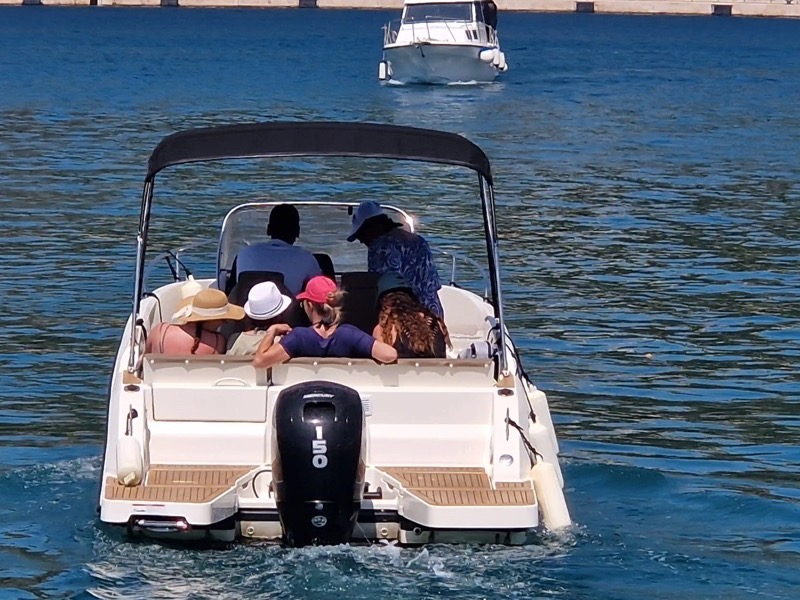 Guests relaxing with refreshments on a private Blue Cave tour near Dubrovnik